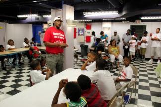 Percy Miller aka Master P talking to kids about his Let Kids Grow Foundation. Image Courtesy: Plugged Entertainment Magazine
